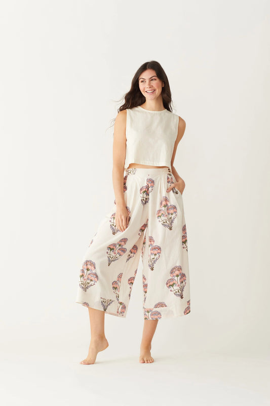 Image of model wearing MAELU DESIGNS Hand Block Printed Fleur Cotton Pant. Fleur Pants are a wide cut, culotte style trouser with a cropped length and all over floral print. 