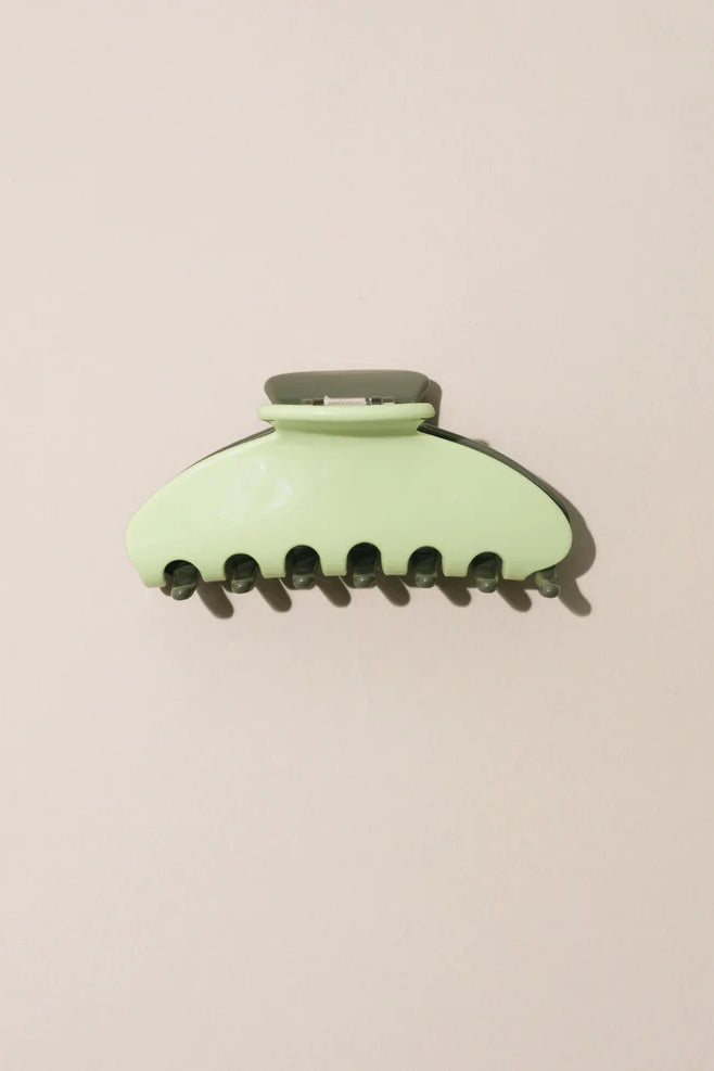 NAT AND NOOR Ethically Made Sustainable Hair Accessories - Large 4" Minimalist Hair Claw in Lemongrass Green on Flat Surface