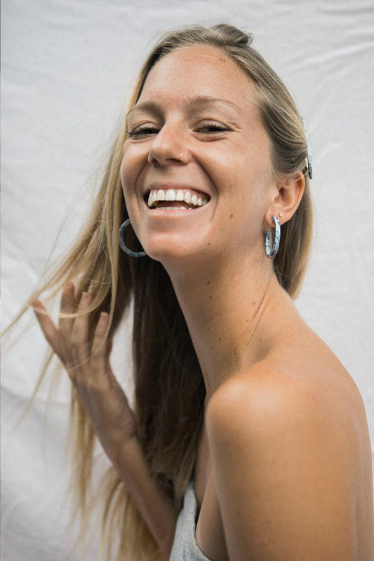 NAT & NOOR Ethically Made Sustainable Jewelry - Nora Mid Size Hoop in Blue Ocean Tortoise on Model