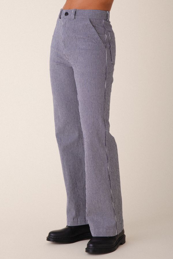 Image of model wearing Prairie Underground Long Smithy Pant in Oyster Stripe. Made in USA.