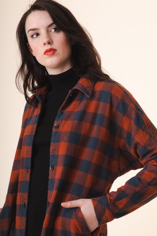 Image of model in Prairie Underground Organic Cotton Red and Navy Buffalo Plaid Shirt Dress over Black Rib Turtleneck - Ethically Made Fashion - Made in USA Women's Apparel