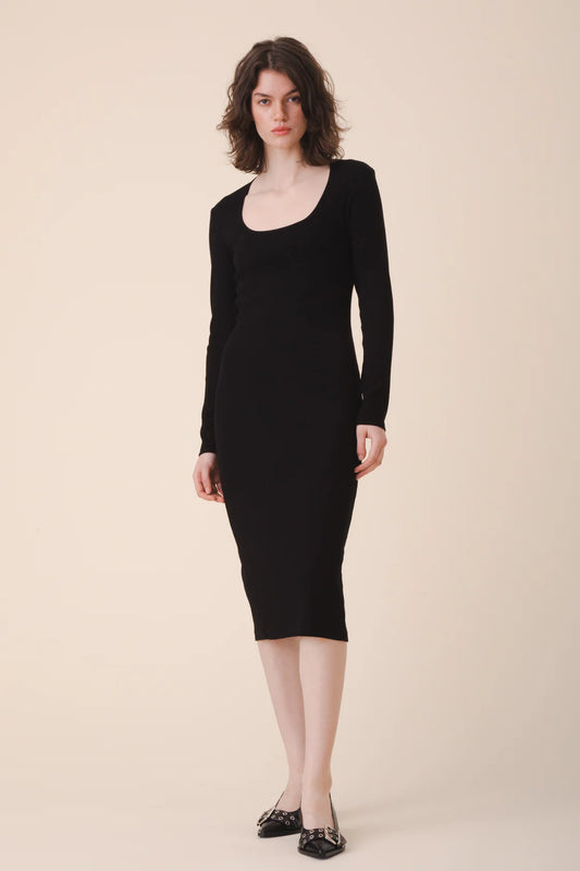 Image of model in Prairie Underground Organic Cotton Black Long Sleeve Ribbed Midi Bodycon Dress with Scoop Neckline _ Ethical Small Batch Women's Fashion Brands _ Eco-friendly Date Night Dresses _ Made in USA Women's Apparel