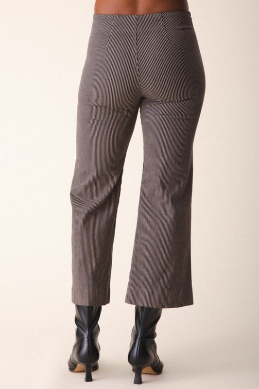 Image of model wearing Prairie Underground Knack Pant in Khaki Railroad Stripe. Knack Pant is a cropped, wide leg, high-stretch pant with flattering darting and zip closure. Designed and produced in Seattle, Washington, USA.