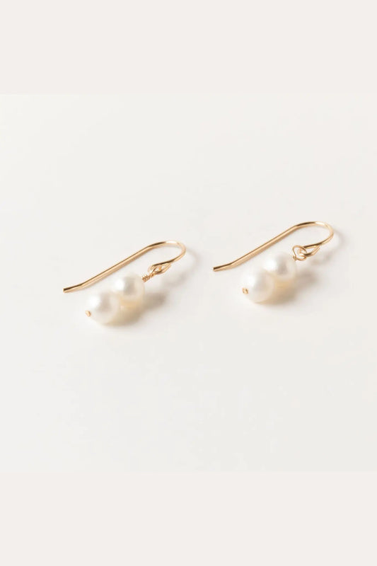 Image of Sheena Marshall Jewelry handmade Pearl Drop Earring - dual pearl pendant on pull through 14k goldfill hook earring. Simple, luxurious jewelry handmade in Denver, Colorado.
