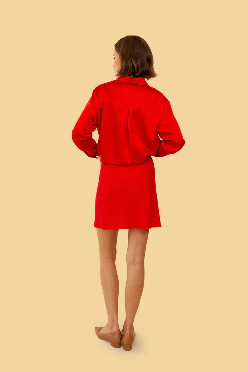 Image on model of Whimsy and Row Cherry Red TENCEL Chelsea Mini Skirt styled with Red Button Down _ Ethical Women's Fashion _ Made in Los Angels USA Women's Apparel