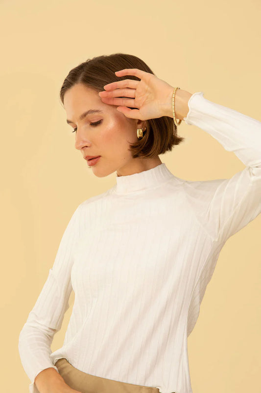 Image of model in Whimsy Row Cream Eco-Rib Gigi Mockneck Top _ Eco-Friendly Women's Fashion Brands _ Made in Los Angeles USA Women's Apparel