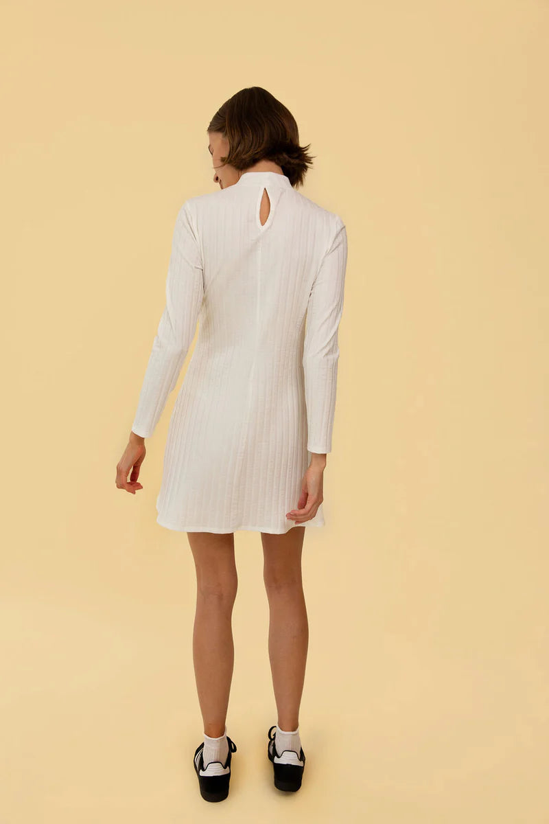 Image of model in Whimsy and Row Cream White Gigi Ribbed Turtleneck Mini Dress _ Eco Friendly Women's Fashion  _ Made in Los Angeles USA Women's Apparel