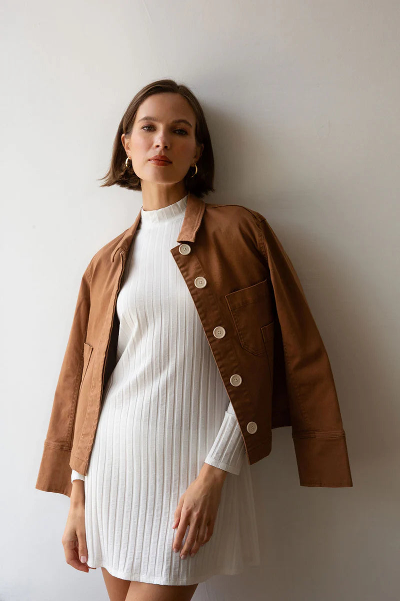 Image of model in Whimsy and Row Cream White Gigi Ribbed Turtleneck Mini Dress _ Eco Friendly Women's Fashion  _ Made in Los Angeles USA Women's Apparel