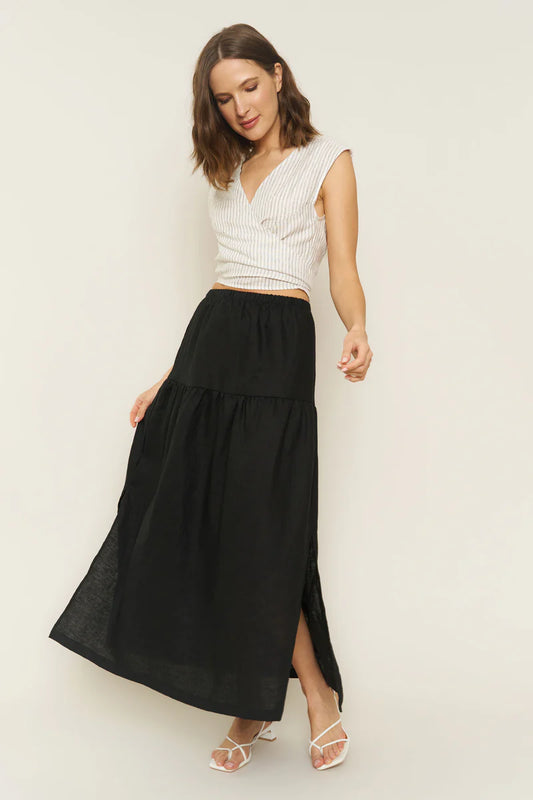 Image of model wearing Millie Convertible Skirt in Black Linen. Millie is a gathered waist Maxi skirt with side slit that can also be worn as a breezy tube dress. Made in USA.