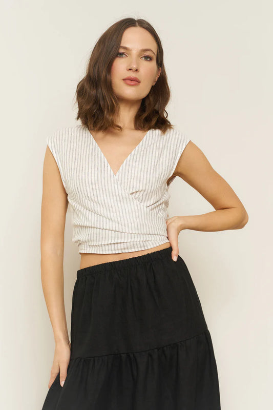 Image of model wearing Whimsy + Row Valentina Tie Top in Stripe Linen. Valentina Top is a square shoulder crop top with tie closure that can be worn back to front. Made in Los Angeles.