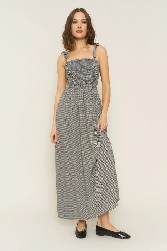 Image of WHIMSY AND ROW SOPHIE SUNDRESS IN BLACK AND WHITE GINGHAM. Sophie Dress is a Maxi length sundress with smocked bodice and adjustable tie shoulder straps. Made in USA from black + white gingham TENCEL fabric.