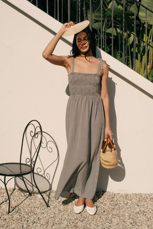 Image of WHIMSY AND ROW SOPHIE SUNDRESS IN BLACK AND WHITE GINGHAM. Sophie Dress is a Maxi length sundress with smocked bodice and adjustable tie shoulder straps. Made in USA from black + white gingham TENCEL fabric.