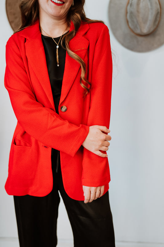 Image on model of Whimsy and Row Cherry Red TENCEL Parker Blazer styled over Black jumpsuit _ Ethical Women's Fashion _ Made in Los Angels USA Women's Apparel