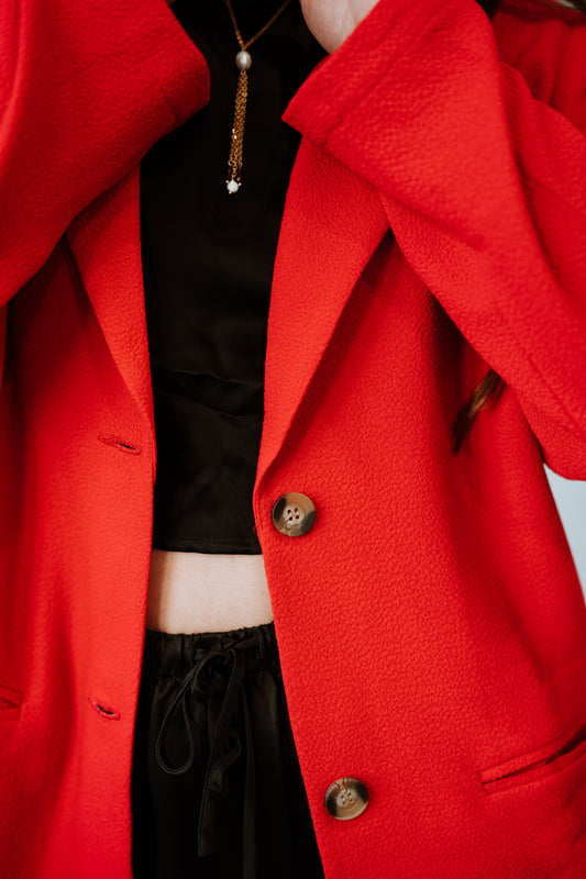 Close up of details on Whimsy and Row Cherry Red TENCEL Parker Blazer Tortoise Buttons styled over Black jumpsuit _ Ethical Women's Fashion _ Made in Los Angels USA Women's Apparel