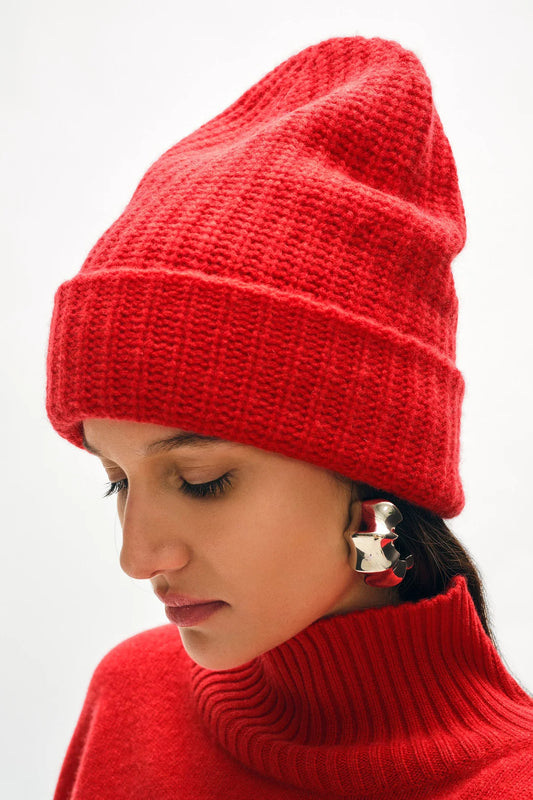 Image of model wearing White + Warren Luxe Cashmere Ribbed Beanie in On Trend Cherry Red _ Responsibly Sourced Ethical Cashmere _ Female Founded Knitwear Brands