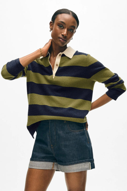 Image of model wearing White + Warren Cashmere Rugby Polo Sweater. This sweater has an oversized fit with all over navy and olive large stripping, contrast cream collar, and tortoise buttons on lapel.